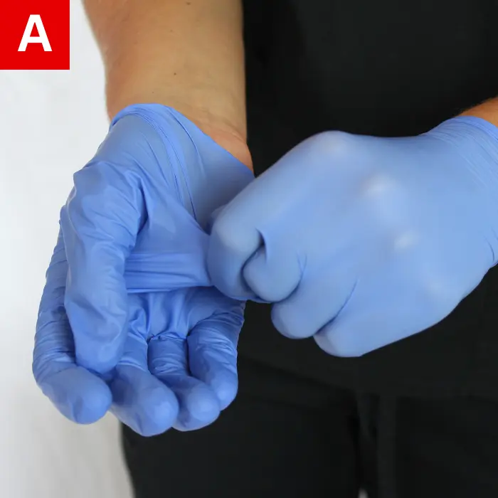 Figure 2a pulling one glove off 