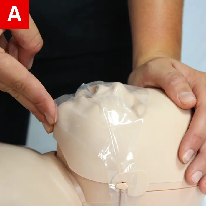 Hold the airway open as described above by gently pressing forehead back and lifting chin with your fingers