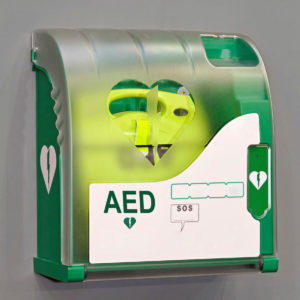 defibrillator in green housing heart