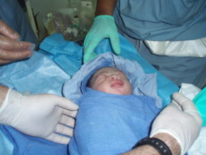 Maxwell delivered by an emergency C-section one week after the 2010 earthquake in Haiti