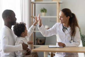 child-patient-high-five-with-doctor