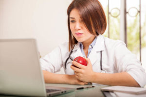 nursing-student-in-front-of-laptop