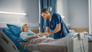 nurse-getting-patients-oxygen-reading