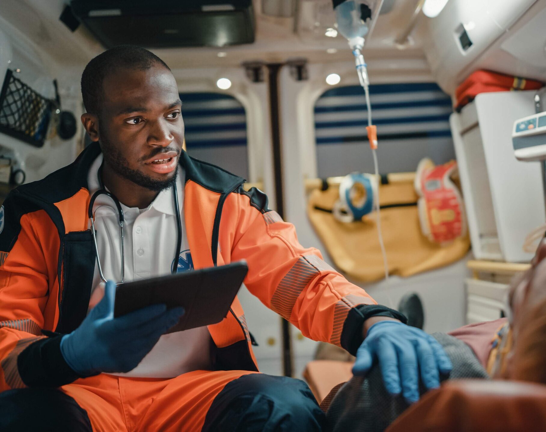 Paramedic in ambulance with a patient