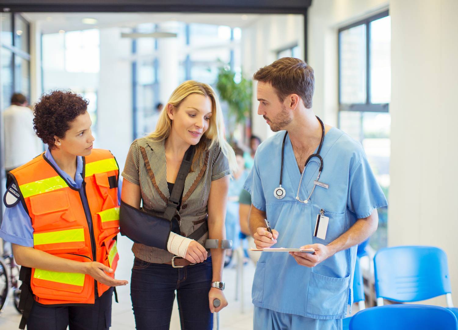 Medical professionals and an emergency responder assisting a patient, illustrating Good Samaritan Law in action.